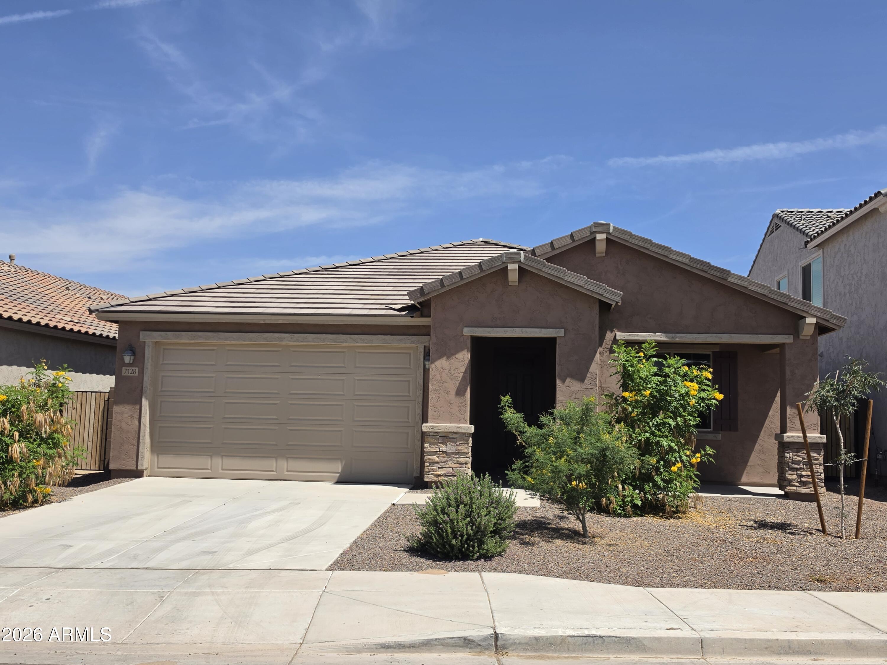 7128 West Coles Road Laveen, AZ 85339 - Photo 1 of 38 front view of a house