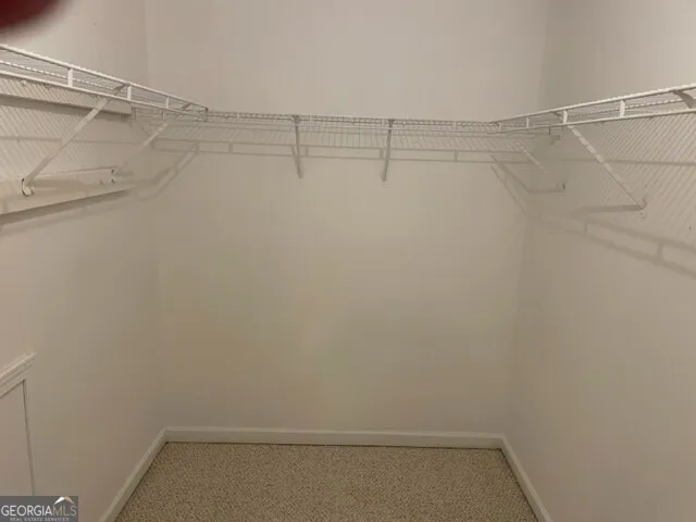 a view of a room with racks on the wall