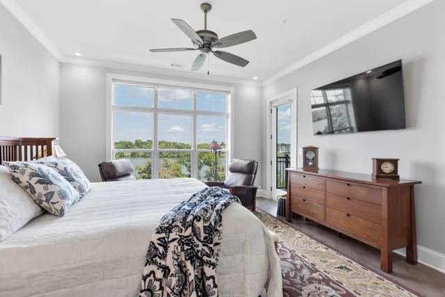 a bedroom with a bed a couch and dresser