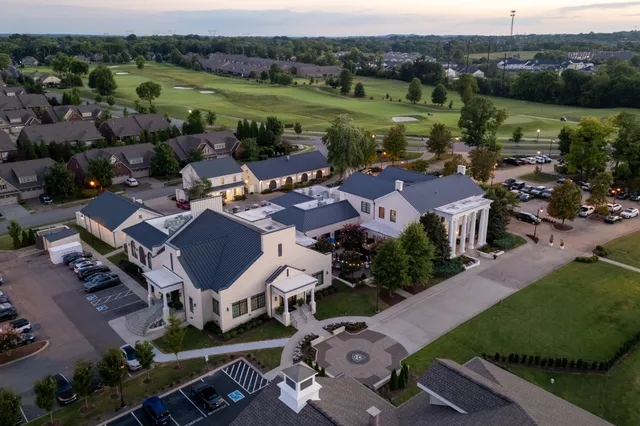 a view of a large building with a yard