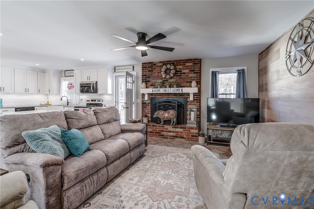 20903 Matoaca Road Petersburg, VA 23803 - Photo 13 of 42 a living room with furniture and a fireplace