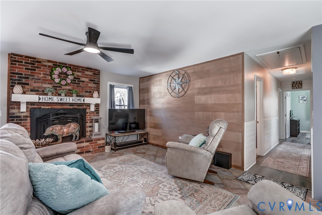 20903 Matoaca Road Petersburg, VA 23803 - Photo 14 of 42 a living room with furniture and a fireplace