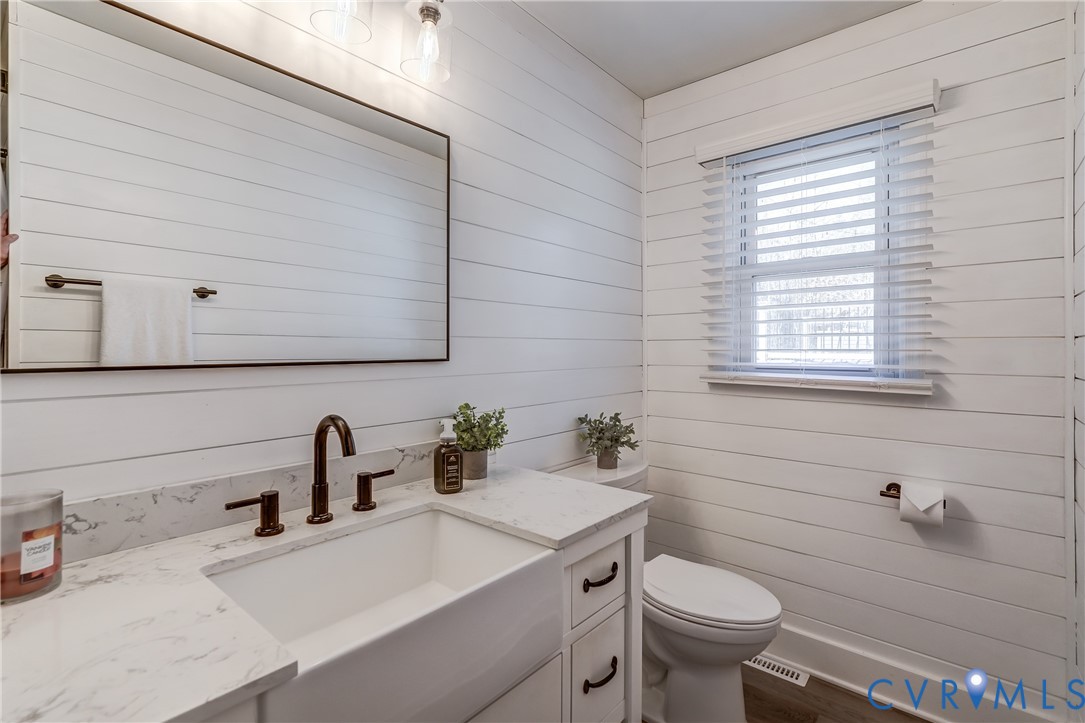 20903 Matoaca Road Petersburg, VA 23803 - Photo 17 of 42 a bathroom with a sink toilet and window