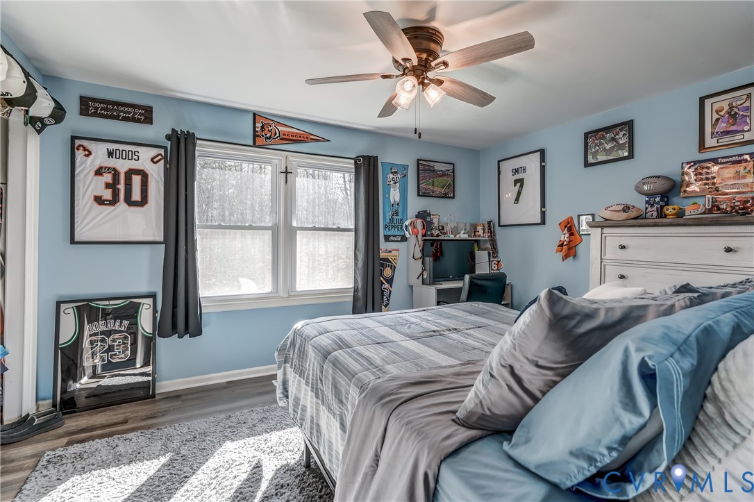 20903 Matoaca Road Petersburg, VA 23803 - Photo 18 of 42 a bed sitting in a bedroom next to a window