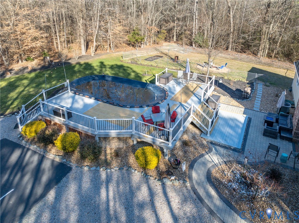 20903 Matoaca Road Petersburg, VA 23803 - Photo 27 of 42 an aerial view of a swimming pool with a yard and seating area