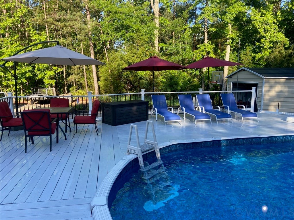 20903 Matoaca Road Petersburg, VA 23803 - Photo 29 of 42 a view of patio with chairs and wooden floor