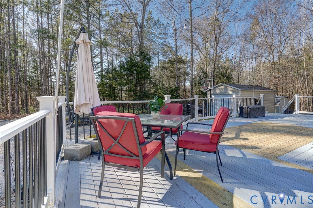 20903 Matoaca Road Petersburg, VA 23803 - Photo 31 of 42 a view of a roof deck with chair and wooden floor
