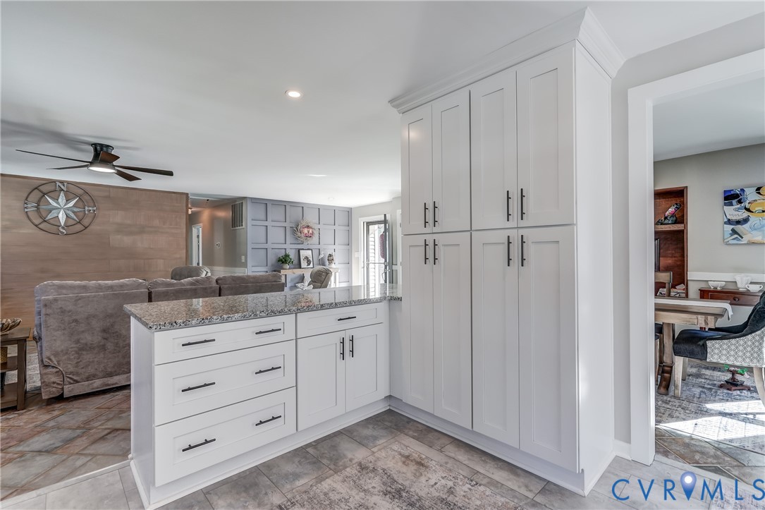 20903 Matoaca Road Petersburg, VA 23803 - Photo 7 of 42 a kitchen with a refrigerator and cabinets