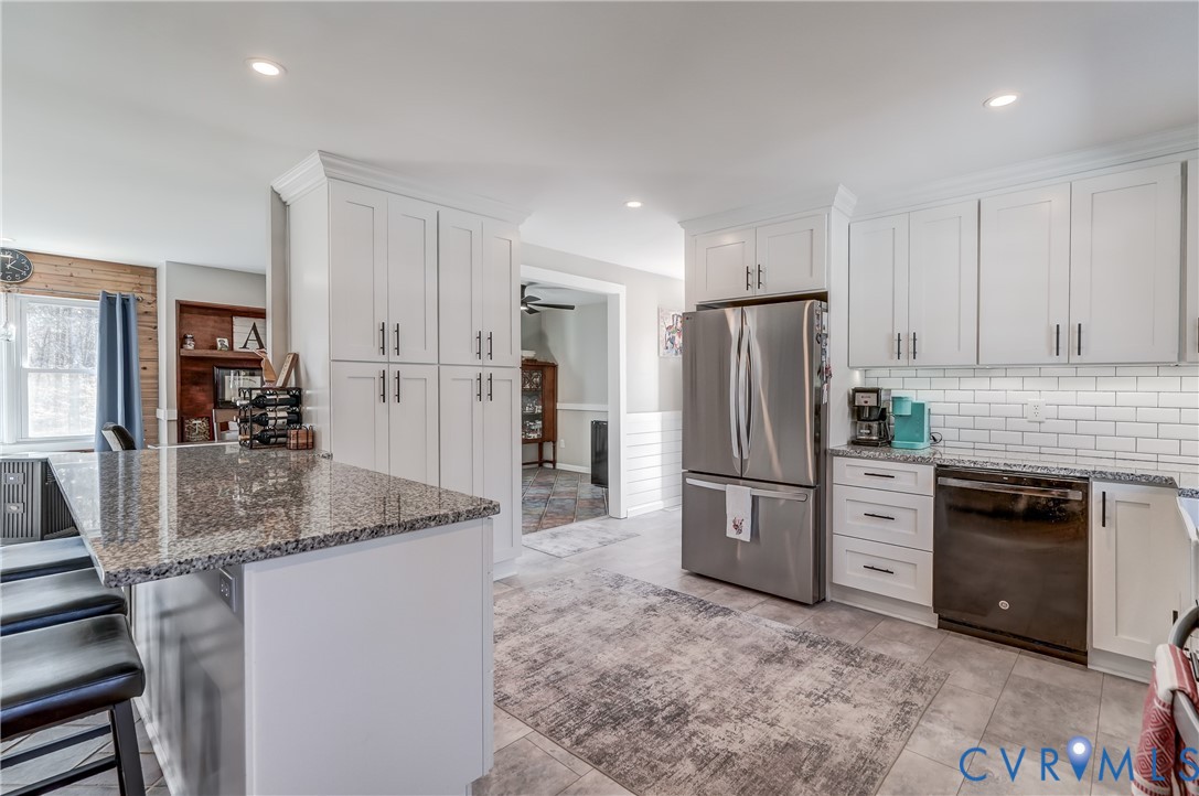 20903 Matoaca Road Petersburg, VA 23803 - Photo 8 of 42 a kitchen with stainless steel appliances granite countertop a refrigerator stove and oven