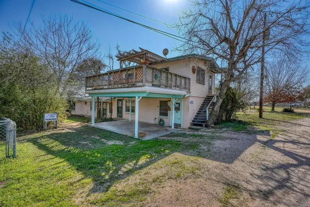 a view of a house with a yard porch and sitting area