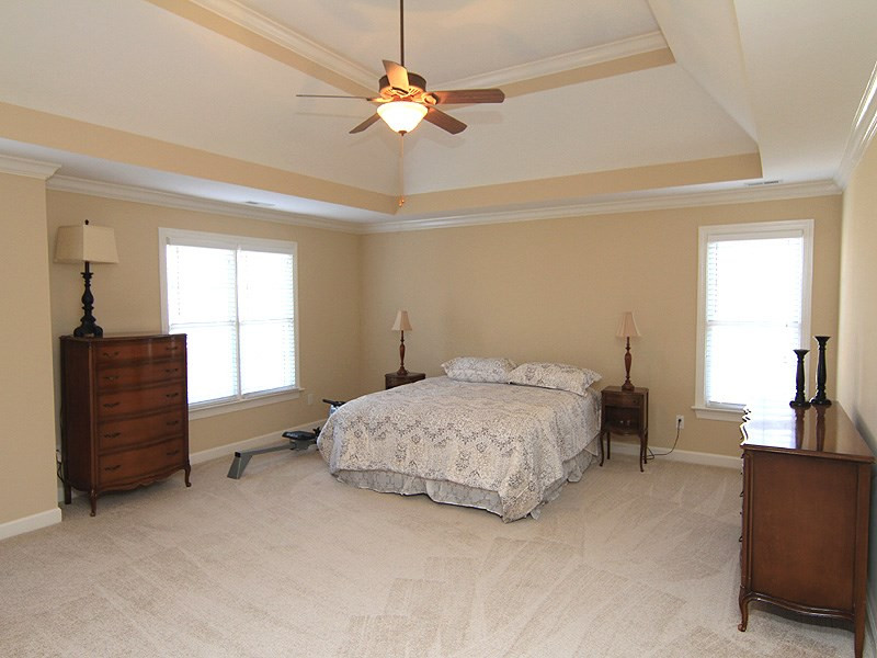 12308 Canolder Street Raleigh, NC 27614 - Photo 14 of 25 The master bedroom is huge with plenty of wall space for furniture. The deep trey ceiling makes the room live even larger. Master Bedroom