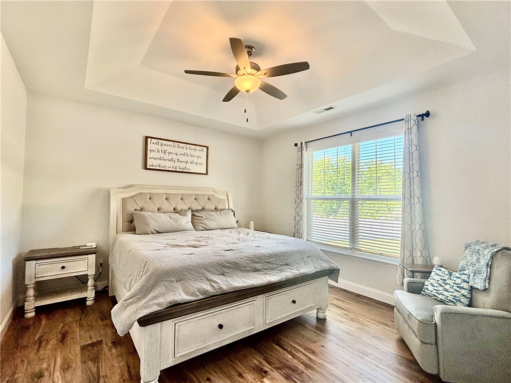 248 Inlet Pointe Drive Anderson, SC 29625 - Photo 14 of 42 This tranquil bedroom offers comfort and a refined aesthetic.