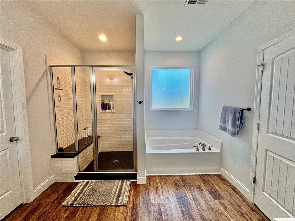 248 Inlet Pointe Drive Anderson, SC 29625 - Photo 18 of 42 Relax and unwind in this spacious bathroom featuring a shower and separate soaking tub.