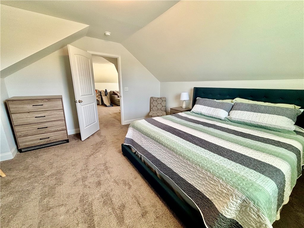 248 Inlet Pointe Drive Anderson, SC 29625 - Photo 28 of 42 This spacious bedroom offers comfortable living with a neutral color palette and plush carpet flooring.