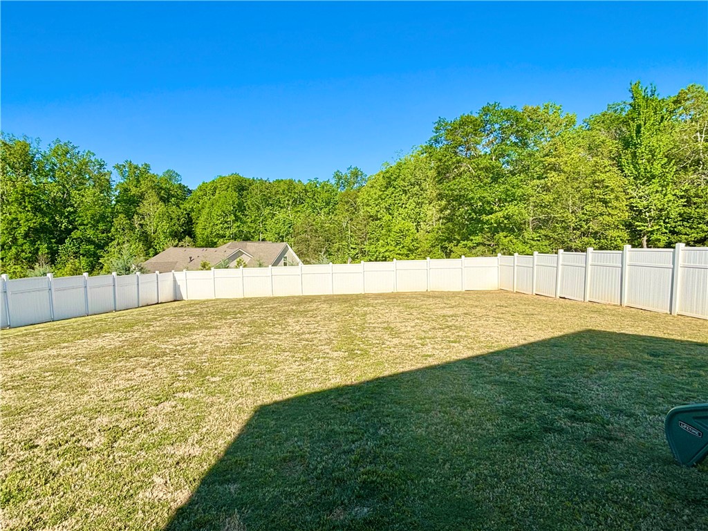 248 Inlet Pointe Drive Anderson, SC 29625 - Photo 37 of 42 This spacious private yard offers a serene retreat with ample green space that's perfect for the children to play or your furry friends.
