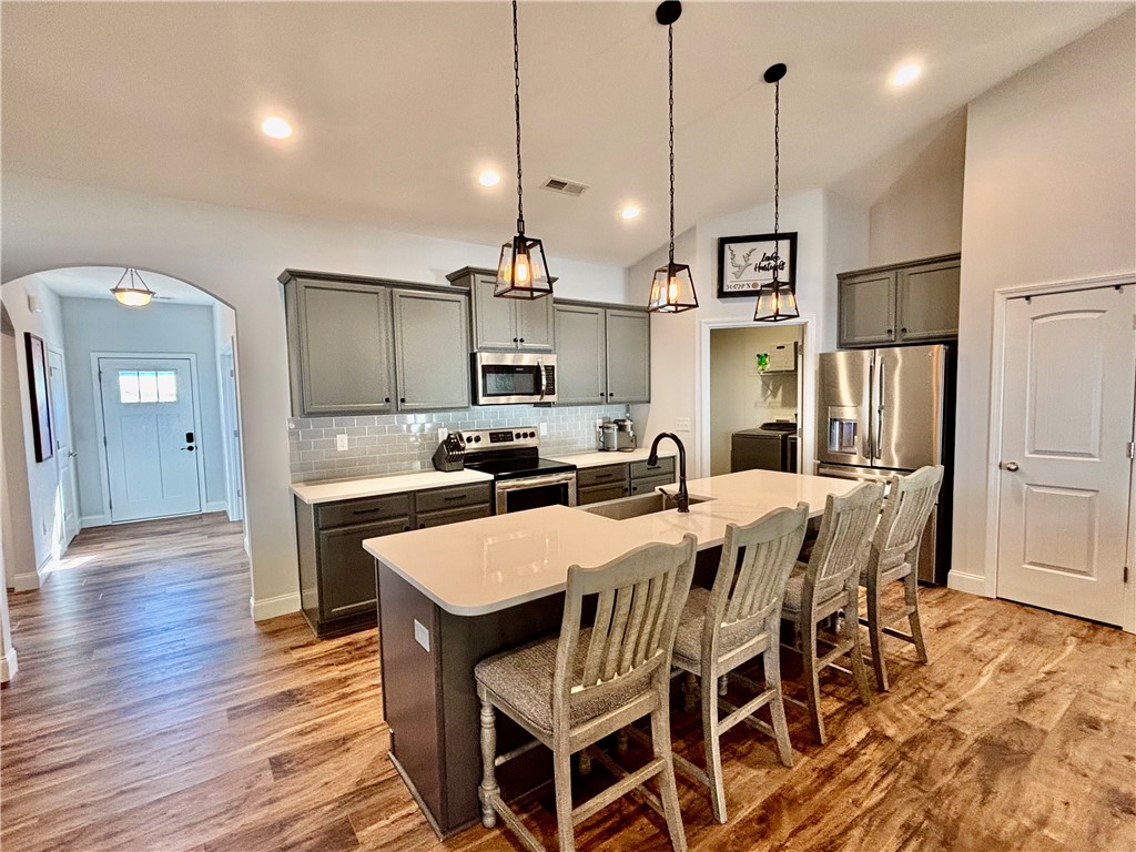 248 Inlet Pointe Drive Anderson, SC 29625 - Photo 5 of 42 This modern kitchen features a spacious island and stainless steel appliances.