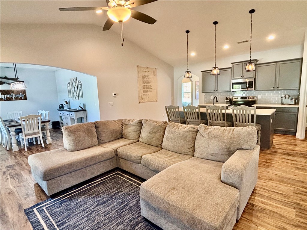 248 Inlet Pointe Drive Anderson, SC 29625 - Photo 10 of 42 This inviting space features a vaulted ceiling and an open-concept design connecting living and dining areas.