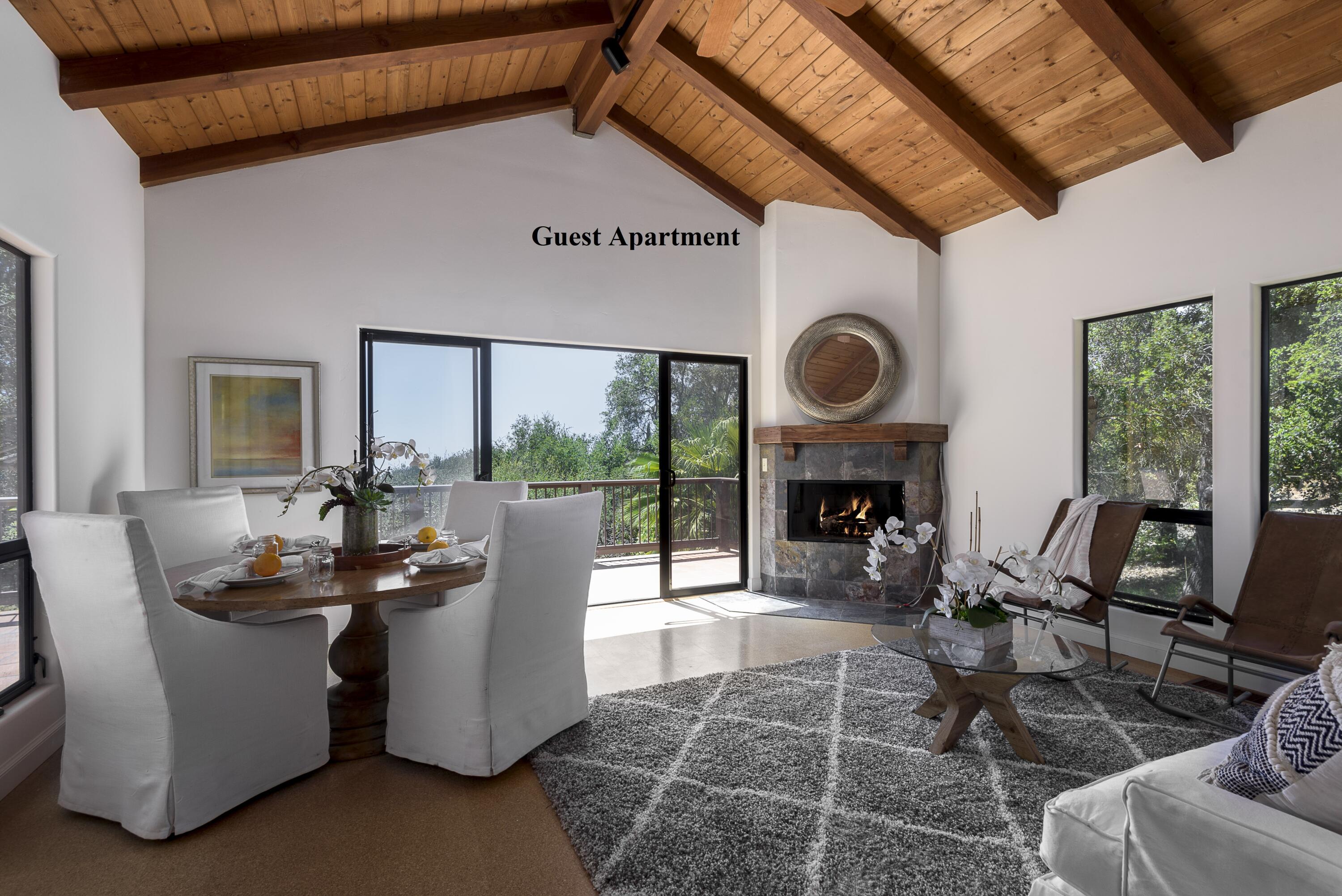 1040 Ladera Lane Montecito, CA 93108 - Photo 12 of 18 a living room with furniture a fireplace and floor to ceiling windows