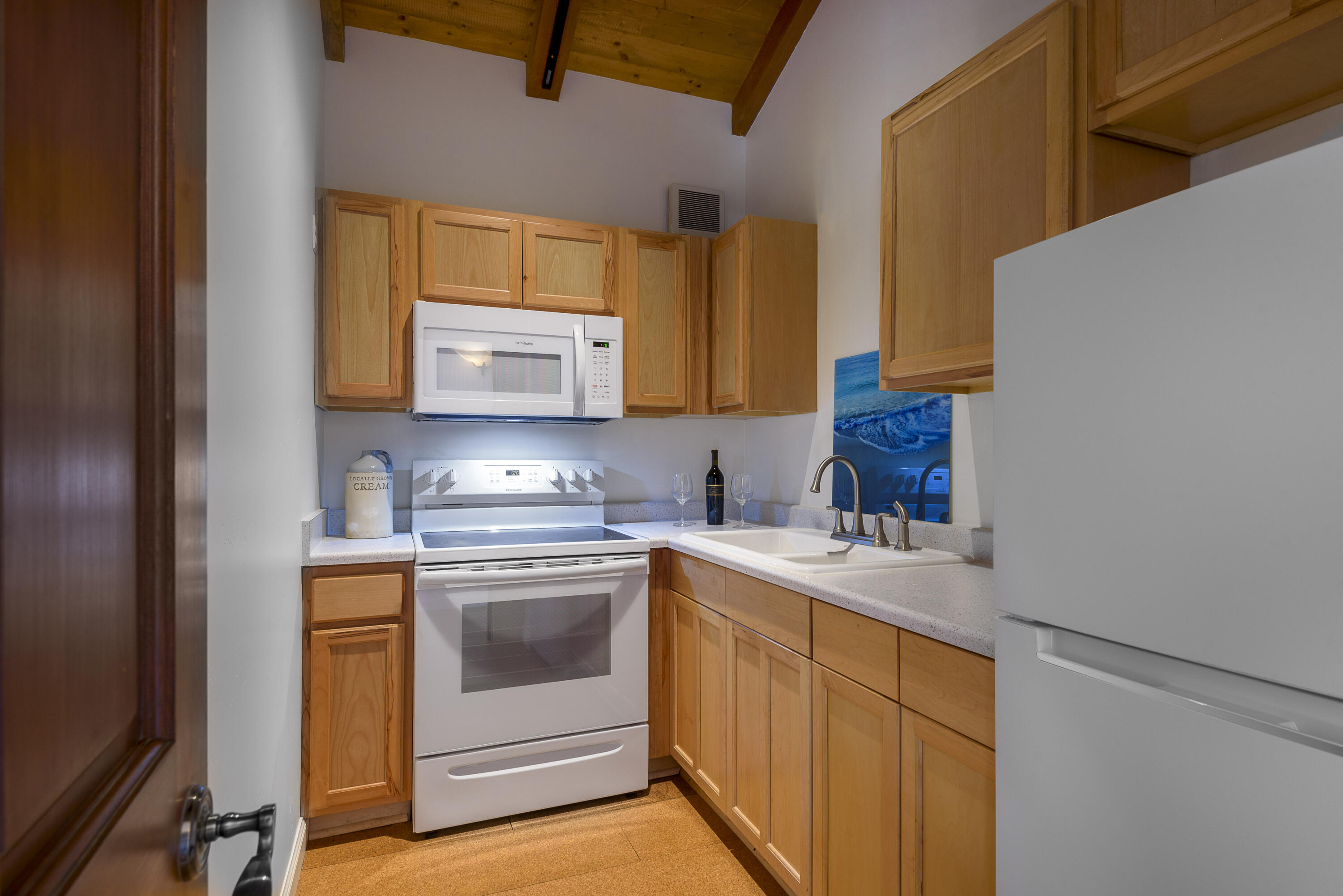 1040 Ladera Lane Montecito, CA 93108 - Photo 13 of 18 a kitchen with a sink stove and microwave