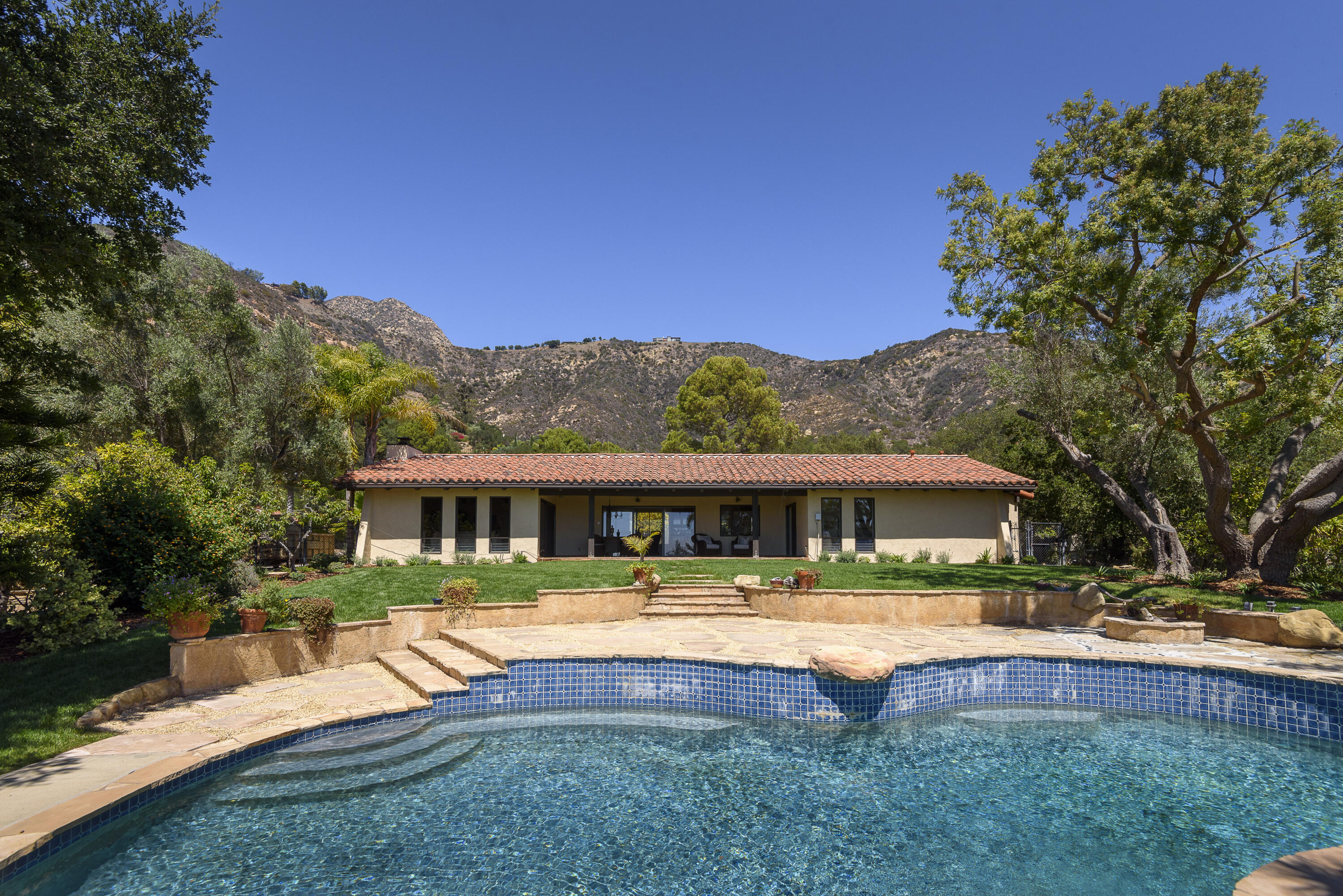 1040 Ladera Lane Montecito, CA 93108 - Photo 16 of 18 a view of swimming pool with outdoor seating and a garden