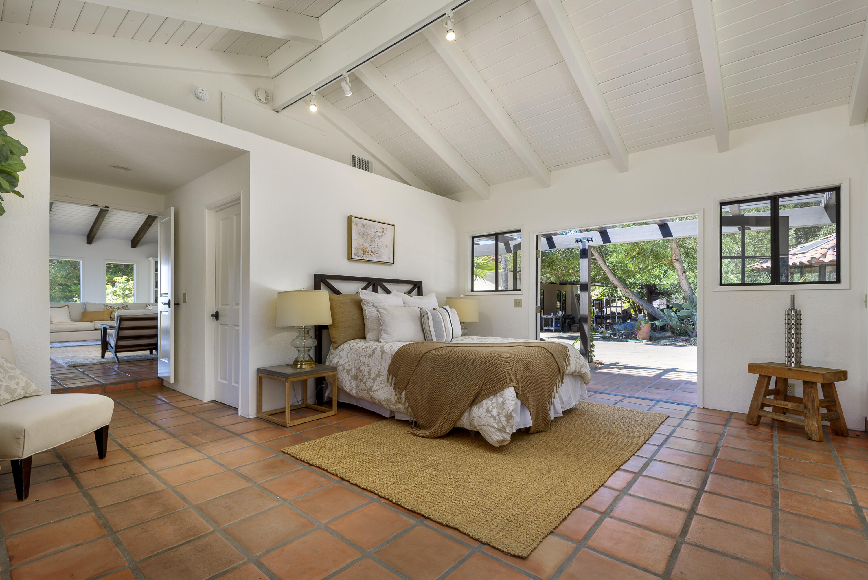 1040 Ladera Lane Montecito, CA 93108 - Photo 6 of 18 a spacious bedroom with a bed and large windows