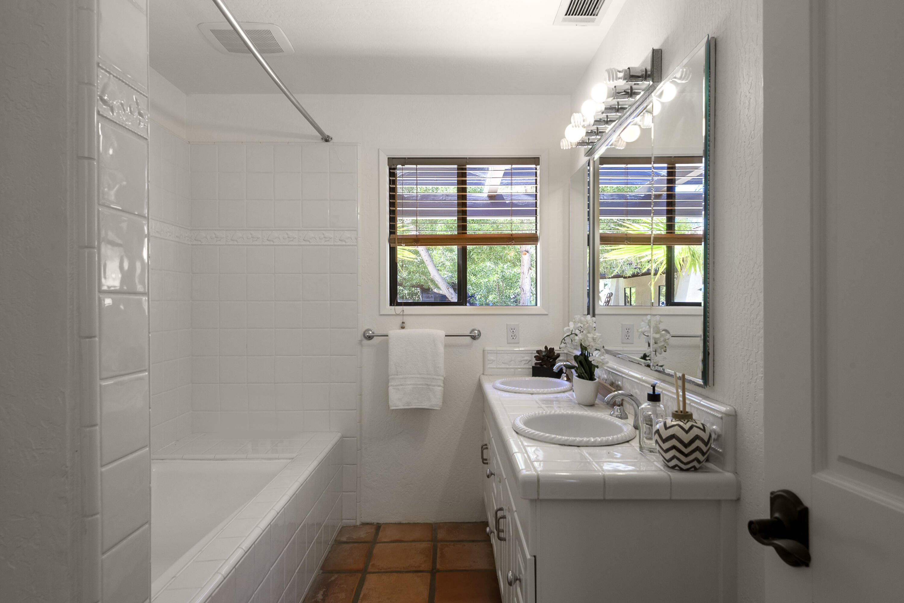 1040 Ladera Lane Montecito, CA 93108 - Photo 7 of 18 a bathroom with a sink a bathtub and next to a window
