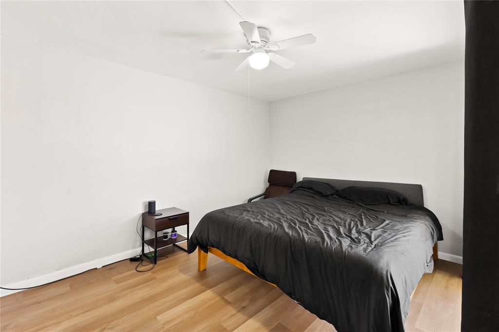 3199 Foxcroft Road, Unit 304 Miramar, FL 33025 - Photo 12 of 23 a bedroom with a bed and a chandelier