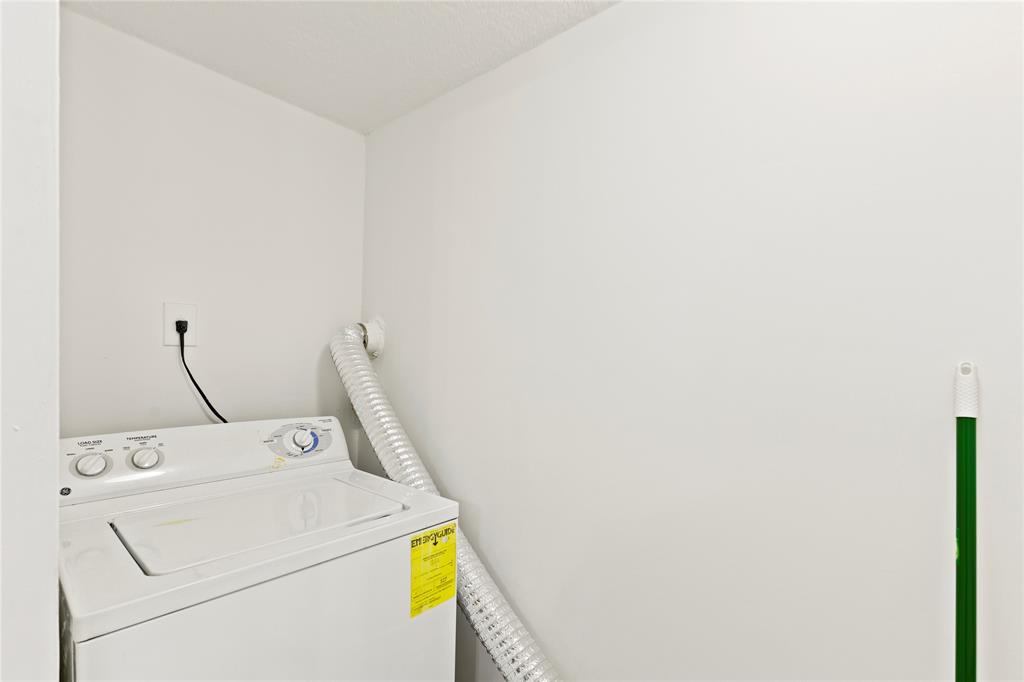 3199 Foxcroft Road, Unit 304 Miramar, FL 33025 - Photo 17 of 23 a utility room with dryer and washer