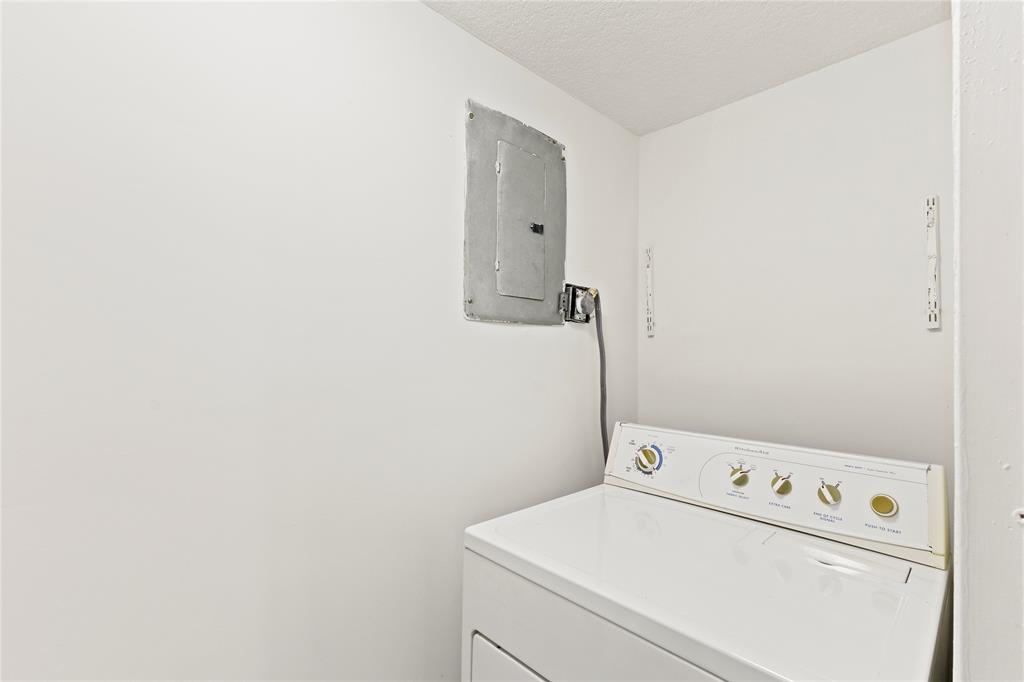 3199 Foxcroft Road, Unit 304 Miramar, FL 33025 - Photo 18 of 23 a utility room with dryer and washer