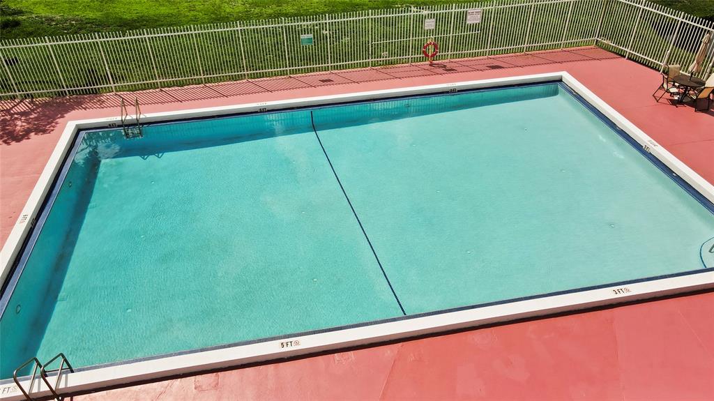 3199 Foxcroft Road, Unit 304 Miramar, FL 33025 - Photo 22 of 23 a view of swimming pool from a balcony