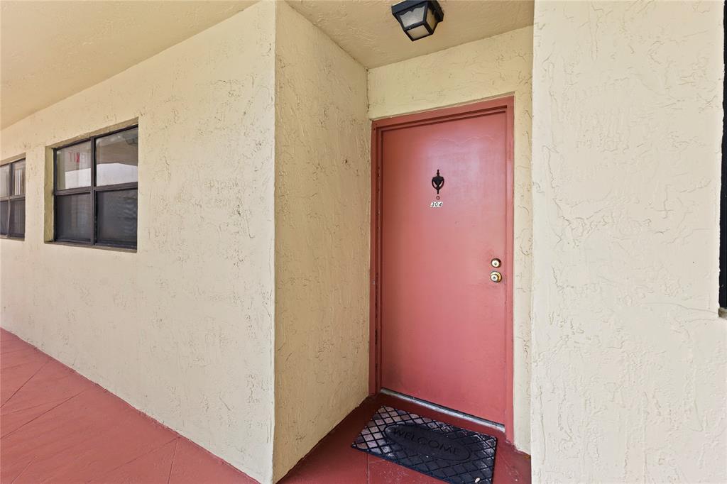 3199 Foxcroft Road, Unit 304 Miramar, FL 33025 - Photo 3 of 23 a view of hallway