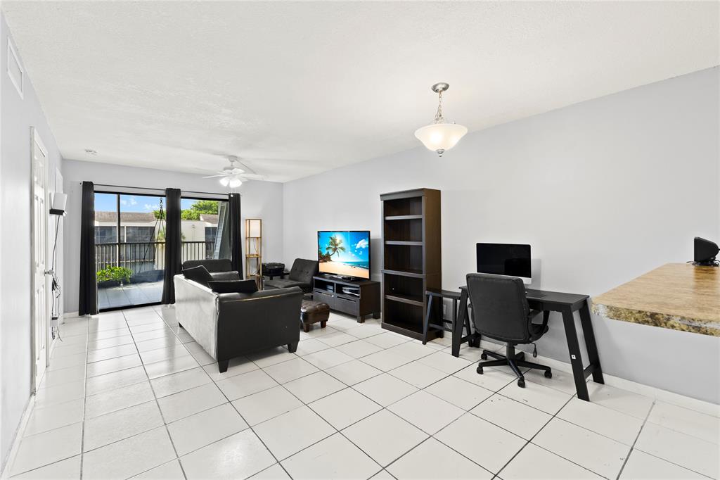 3199 Foxcroft Road, Unit 304 Miramar, FL 33025 - Photo 7 of 23 a view of a workspace with furniture and a window