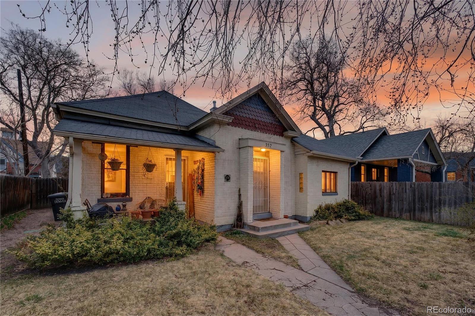 352 Bannock Street Denver, CO 80223 - Photo 2 of 43 a front view of house with yard and trees around