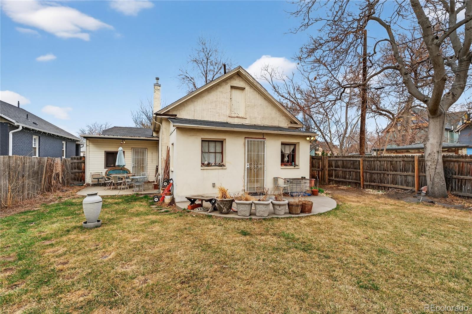 352 Bannock Street Denver, CO 80223 - Photo 21 of 43 a front view of house with yard outdoor seating and barbeque oven