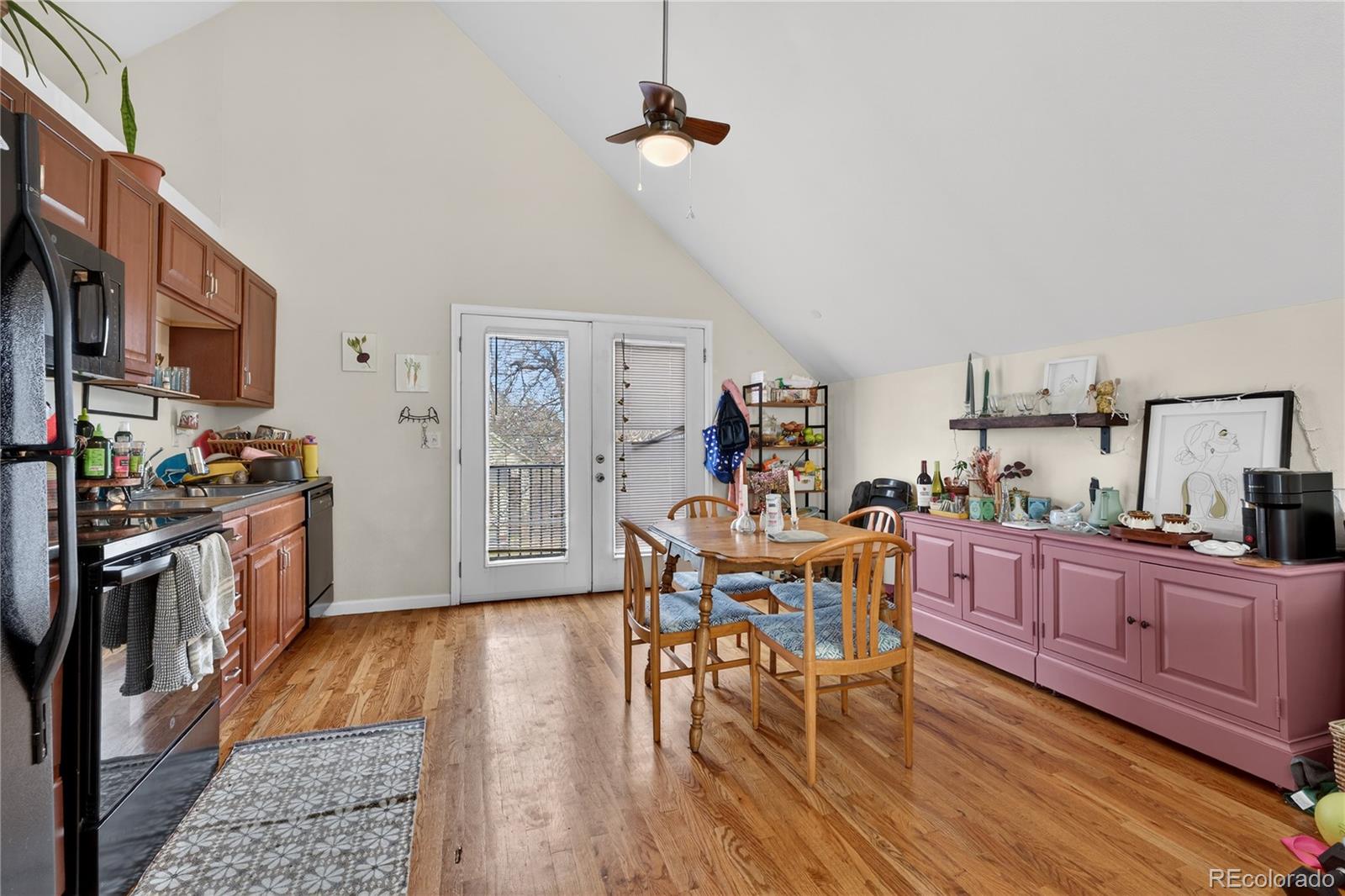 352 Bannock Street Denver, CO 80223 - Photo 27 of 43 a view of a dining room with furniture a chandelier and wooden floor