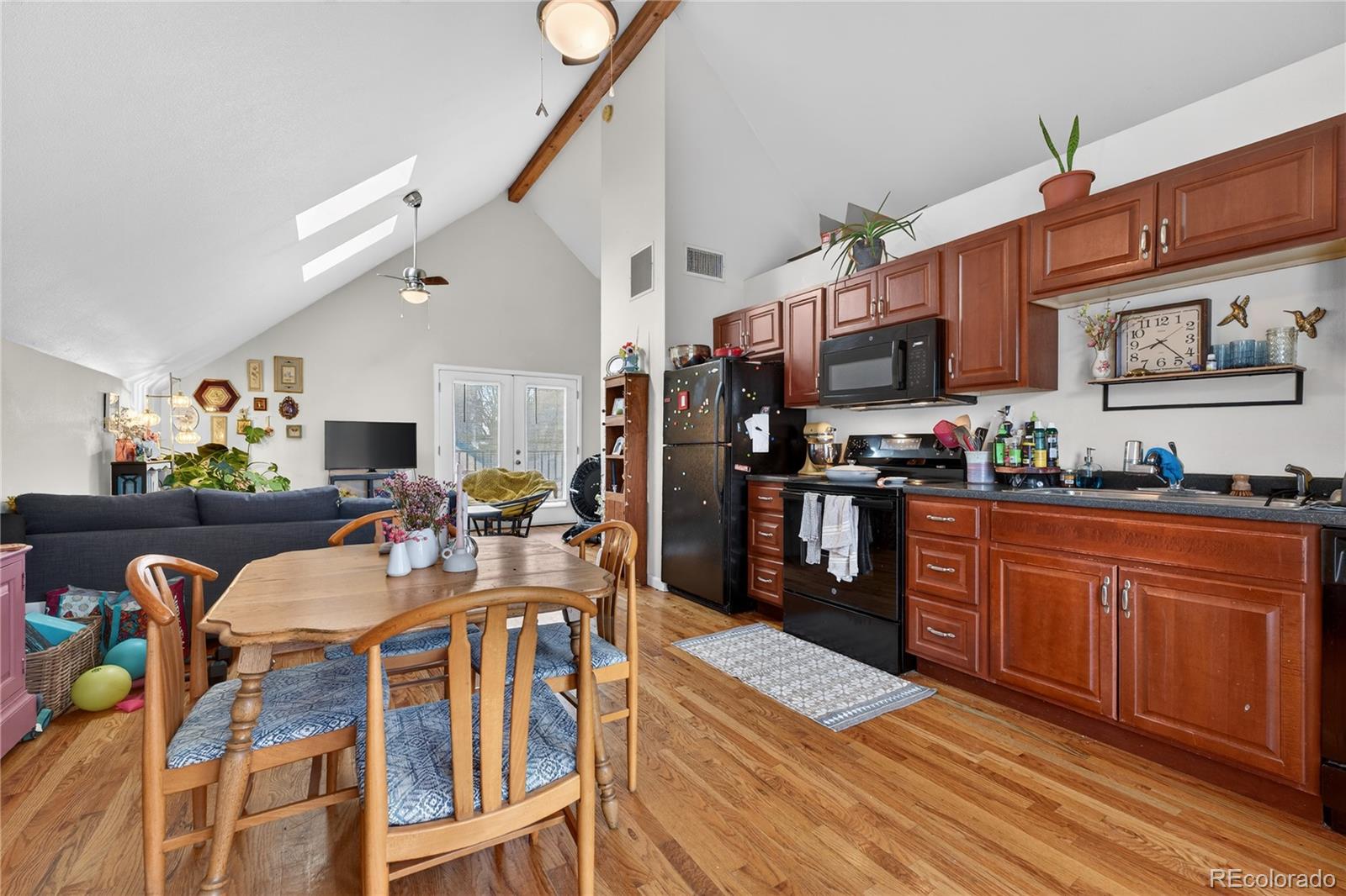 352 Bannock Street Denver, CO 80223 - Photo 29 of 43 a view of a dining room with furniture kitchen and chandelier