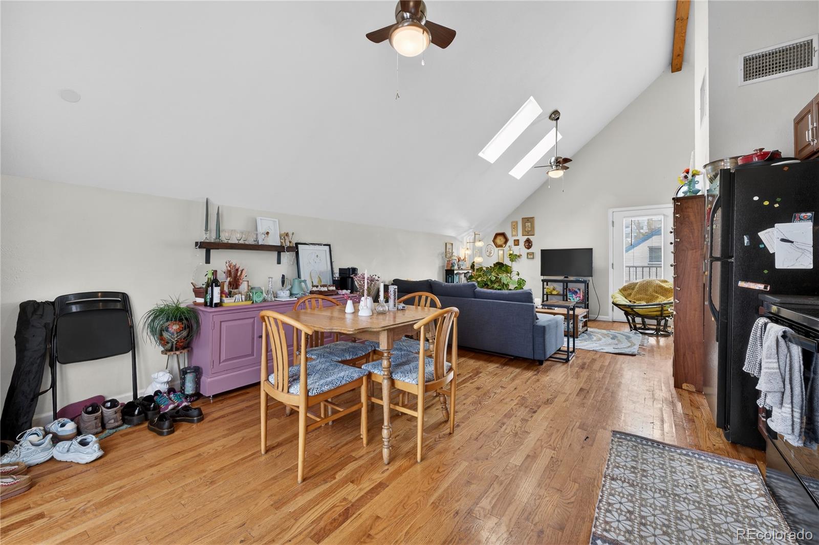 352 Bannock Street Denver, CO 80223 - Photo 30 of 43 a view of a dining room with furniture and a wooden floor