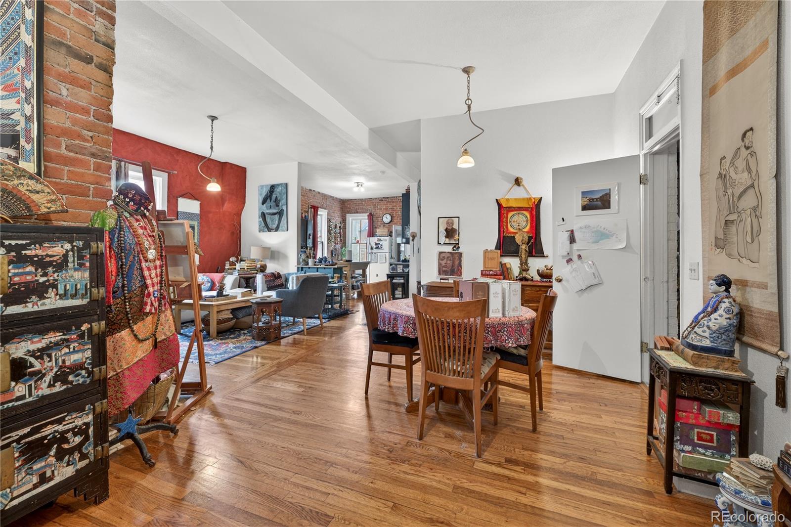 352 Bannock Street Denver, CO 80223 - Photo 4 of 43 a living room with dining room and wooden floor