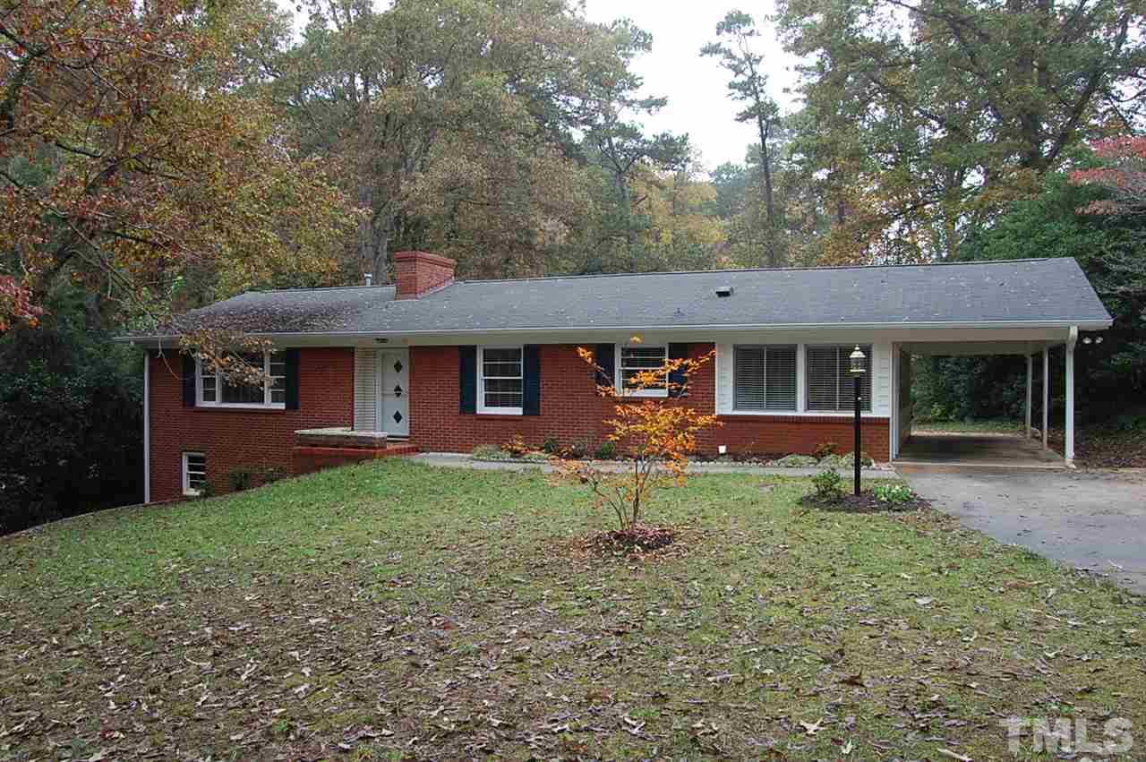 3214 Cyanne Circle Raleigh, NC 27606 - Photo 1 of 21 a front view of a house with garden