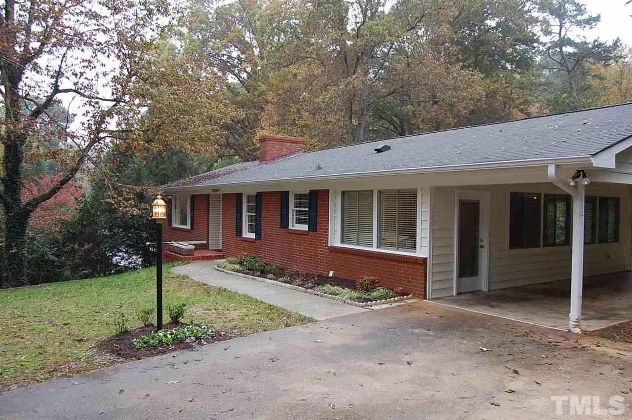3214 Cyanne Circle Raleigh, NC 27606 - Photo 2 of 21 a front view of a house with garden