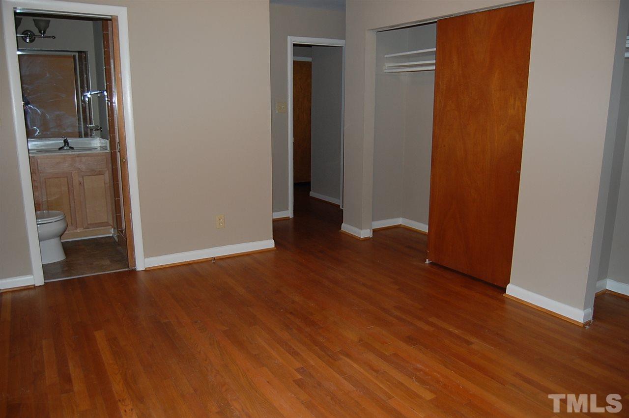 3214 Cyanne Circle Raleigh, NC 27606 - Photo 12 of 21 an empty room with wooden floor and closet