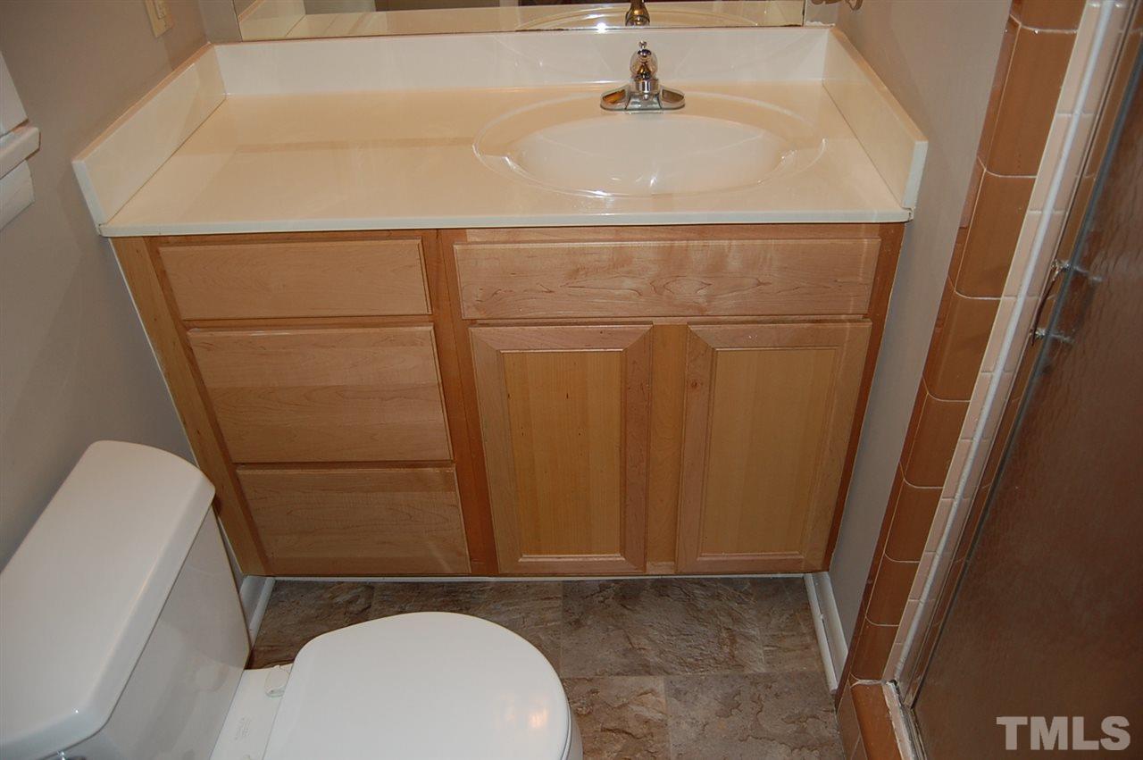 3214 Cyanne Circle Raleigh, NC 27606 - Photo 14 of 21 a bathroom with a sink and toilet