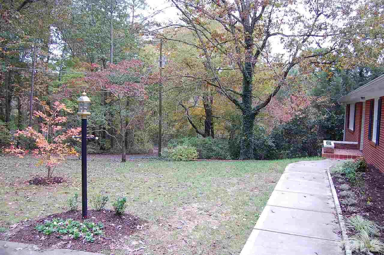 3214 Cyanne Circle Raleigh, NC 27606 - Photo 4 of 21 a backyard of a house with lots of green space
