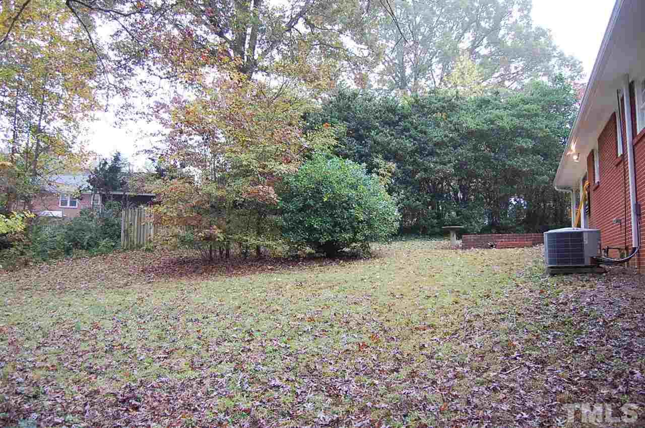 3214 Cyanne Circle Raleigh, NC 27606 - Photo 6 of 21 a view of a yard with plants and a trees