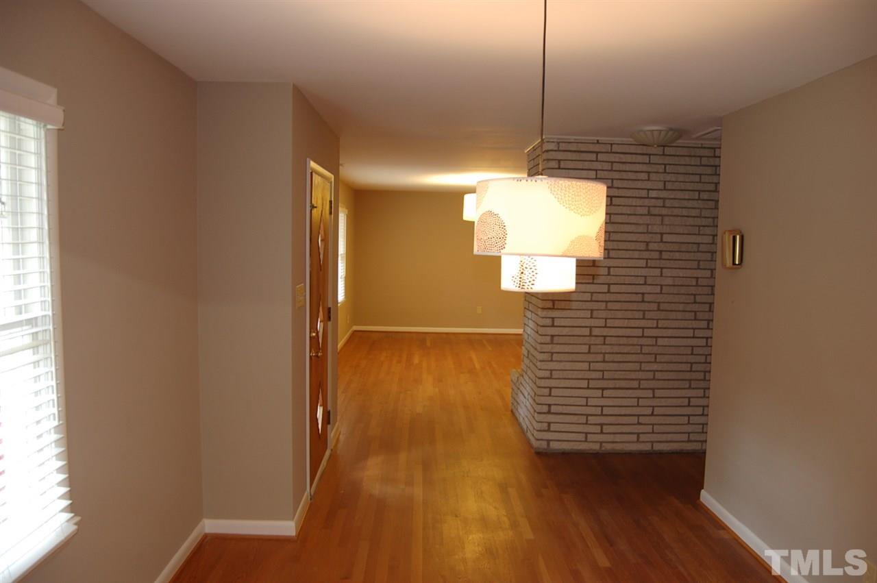 3214 Cyanne Circle Raleigh, NC 27606 - Photo 8 of 21 a view of a hallway with wooden floor and a window