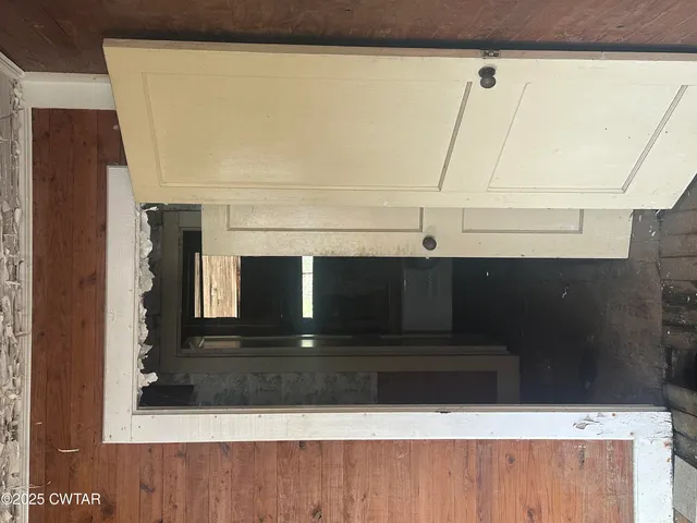 a bathroom with a shower and mirror