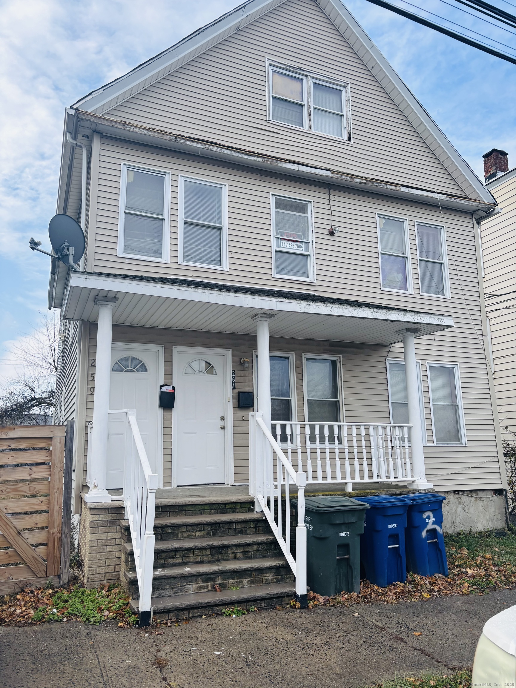 259 6th Street Bridgeport, CT 06607 - Photo 1 of 4 a front view of a house with a balcony