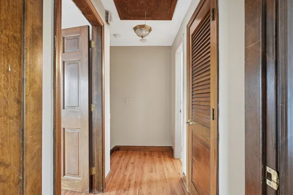 a view of entryway with wooden floor