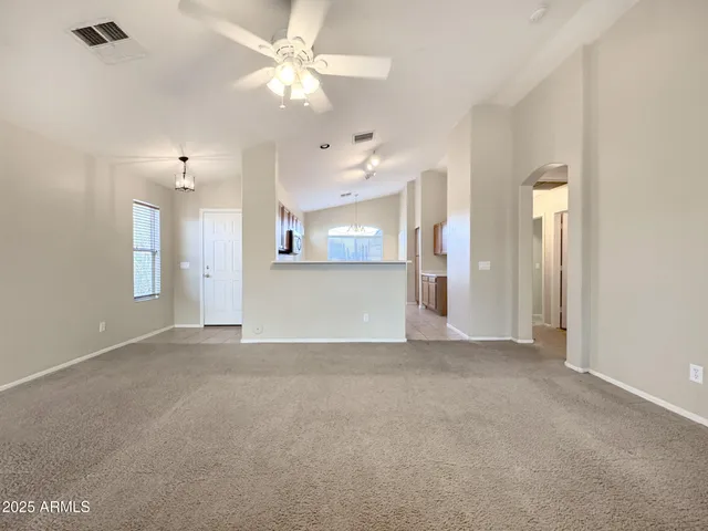 en view interior of a house with a ceiling fan and a window