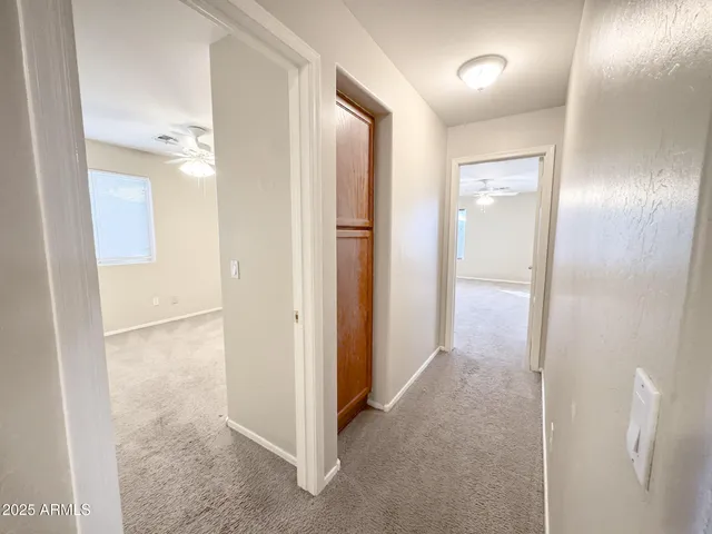 a view of hallway with shower